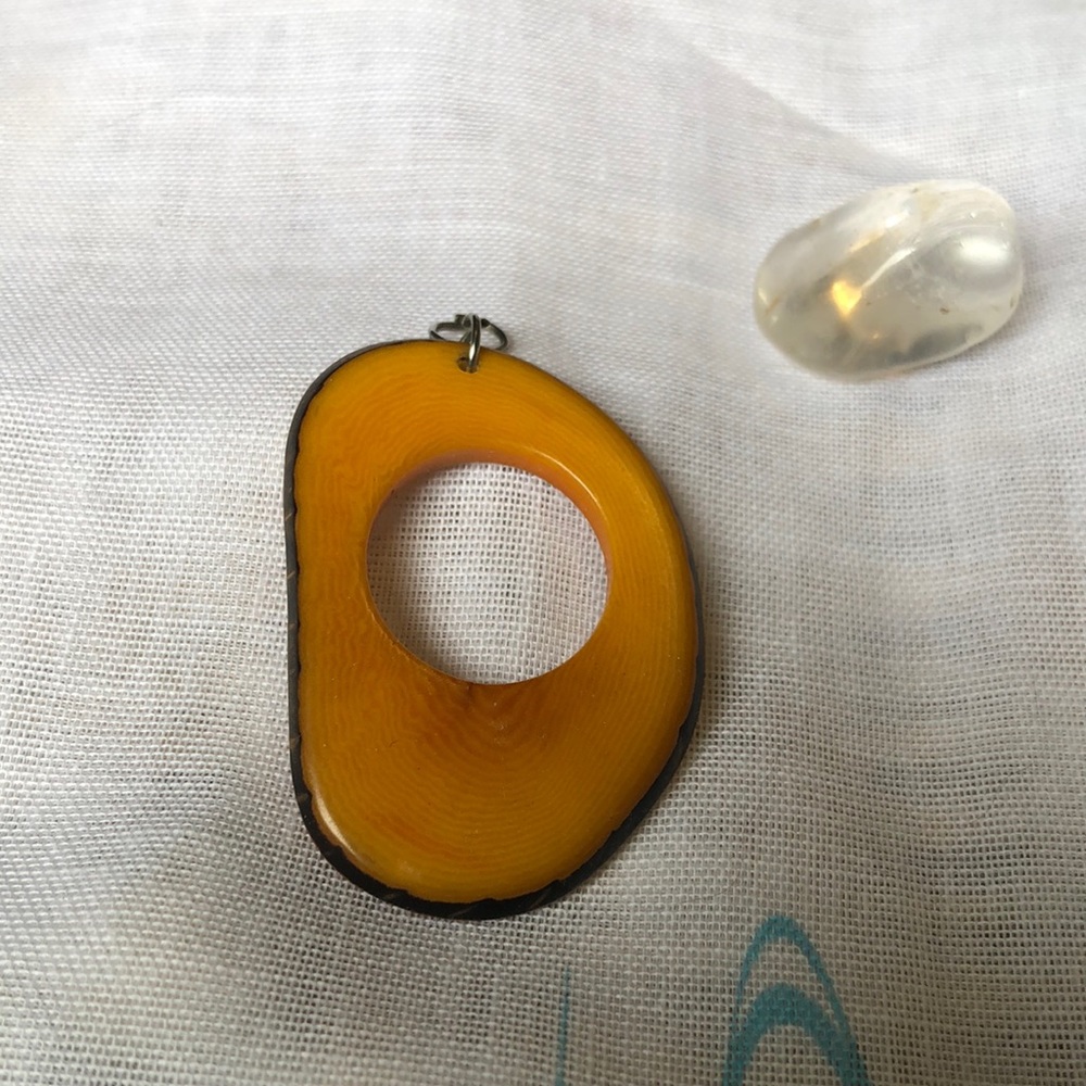 Polished wood pendant with hole